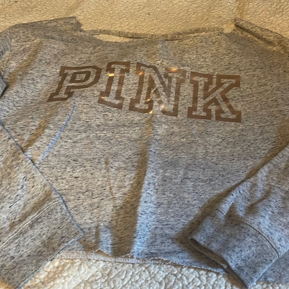 PINK cropped sweatshirt with crisscross pattern on back. Size L.